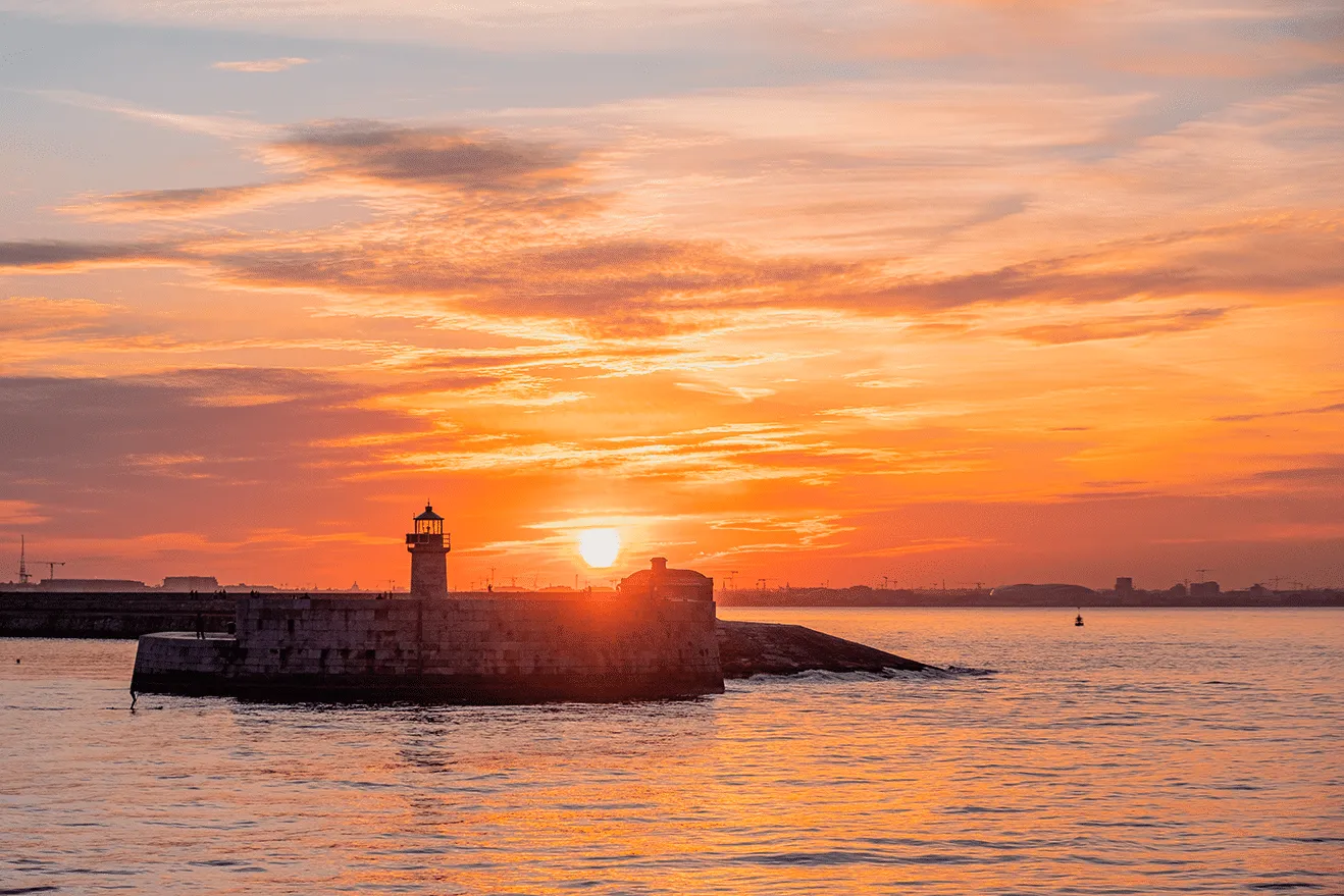 Dún Laoghaire harbour and lighthouse at sunset